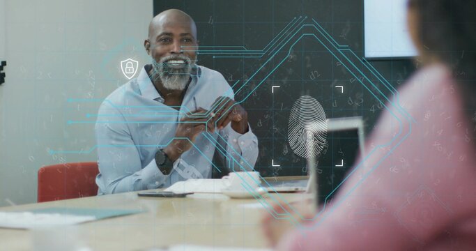 IT consultant in shirt discussing biometric security in office, with fingerprint overlay graphics - Powered by Adobe