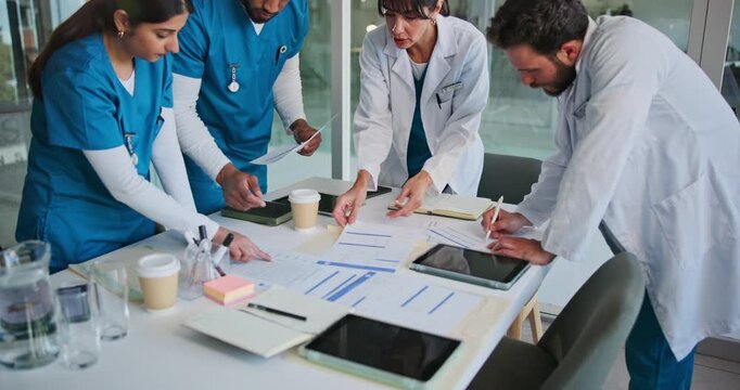 Documents, doctors and nurses in hospital together for collaboration, meeting or training review. Conversation, feedback and medical with healthcare team in clinic for development or education