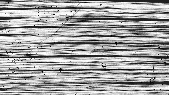 A looped background with a texture of black and white pencil lines and small ink spots.