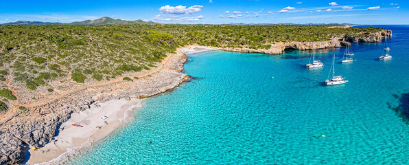Aerial View of Sailboats Anchored Above Turquoise Waters in a Tranquil Mallorca Bay