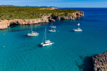 Aerial View of Sailboats Anchored Above Turquoise Waters in a Tranquil Mallorca Bay