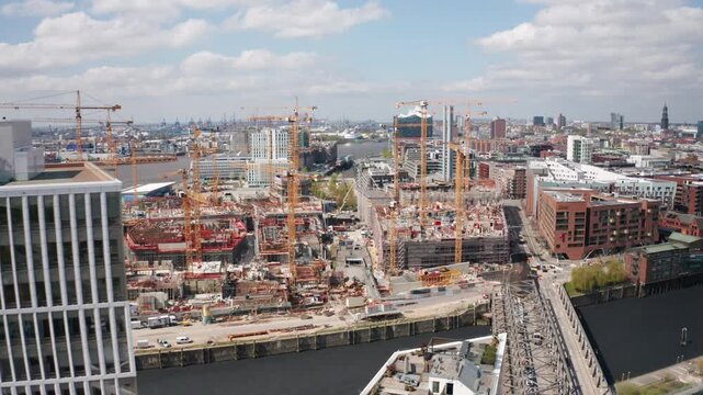 Aerial view of Hamburg&rsquo;s extensive construction site, featuring cranes and new buildings, symbolizing urban economic growth and modern development in Germany and the European Union.