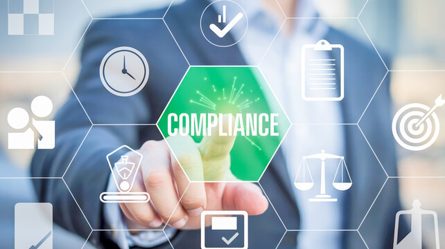 Finger pressing on compliance icon in digital network