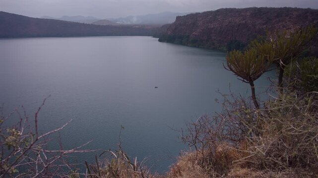 Lonely Fisherman in Small Boat on Lake Chala Kenya