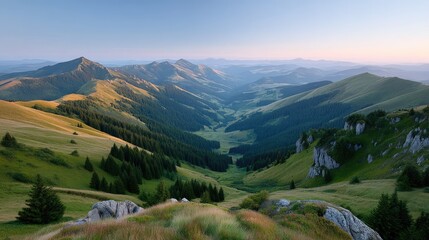 Fototapeta premium Golden Hour Sunlight Illuminates Lush Green Forested Mountain Valley and Rocky Outcrops with a Clear Blue Sky Above at Sunrise