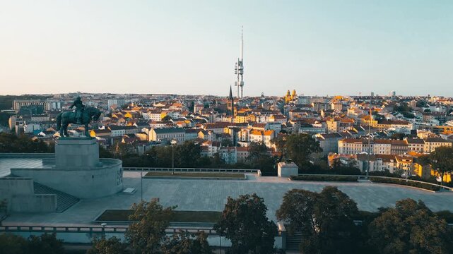 On Vitkov Hill, the Jan Zizka Statue stands majestically against the backdrop of the Zizkov Tower and Prague's vibrant skyline. Experience the beauty of this historic site.