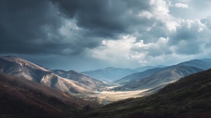 Obraz premium Dramatic overhead clouds illuminate a sweeping mountain valley landscape at twilight