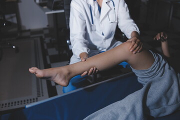 Rehabilitation therapy Professional male physiotherapists working in rehabilitation centers while treating male patients with leg and muscle pain.