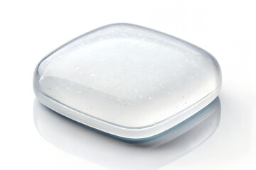 Close up studio shot of a clear round translucent plastic container with soft lighting and subtle shadows