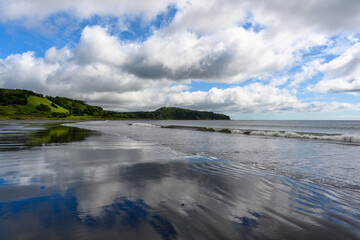 Reflections of nature on the serene shores of Russia's coastline