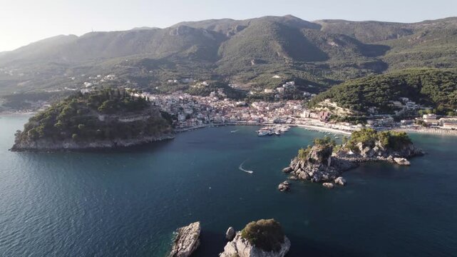 Aerial of tranquil seaside town and mountains