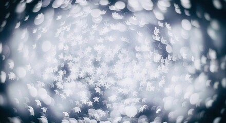 A mesmerizing display of bokeh lights resembling snowflakes creates a magical and festive atmosphere, perfect for capturing the spirit of winter and celebration