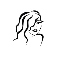 A woman with long hair and a smile. She is wearing a black dress
