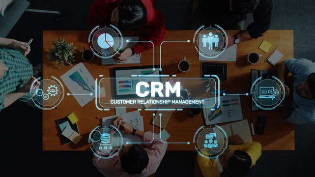 A dynamic business meeting showcasing professionals engaged in customer relationship management discussions, surrounded by data charts and collaborative tools. Raster