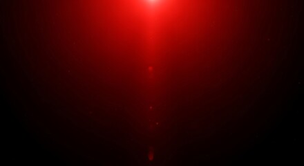 Abstract red light flare effect on dark gradient background