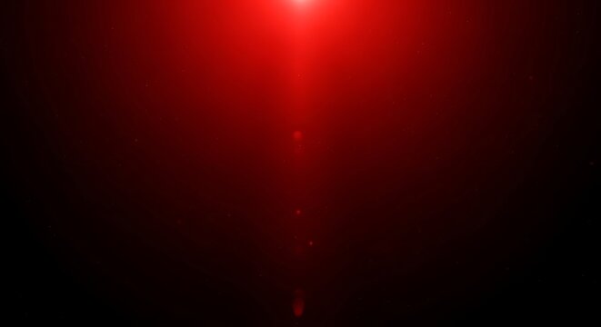 Abstract red light flare effect on dark gradient background