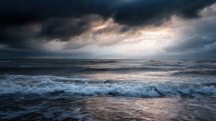 Photograph of a stormy sea. the sky is filled with dark, ominous clouds that are covering the entire horizon. the clouds are dark and billowing, creating a dramatic and ominous atmosphere.