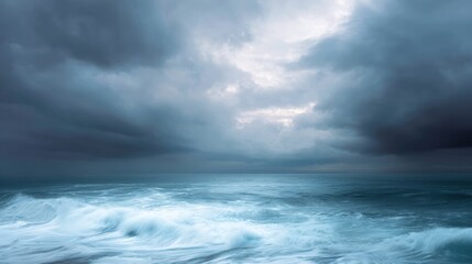 Landscape photograph of a stormy sky over the ocean. the sky is filled with dark, ominous clouds that are covering most of the sky.