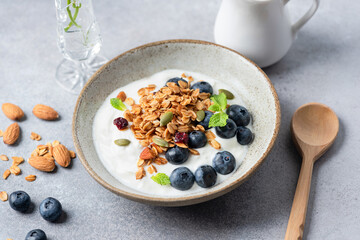 Yogurt bowl with granola and blueberries. Healthy diet meal