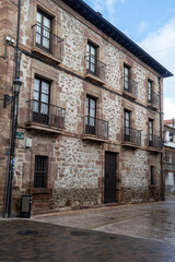 Traditional stone building with wrought iron balconies in Ezcaray, La Rioja