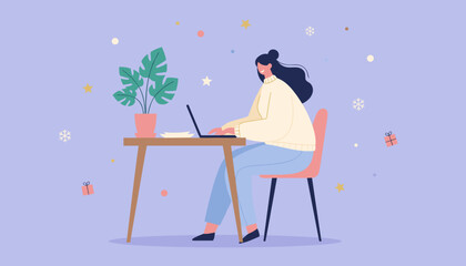 Happy woman working remotely on laptop at cozy desk surrounded by winter holiday elements