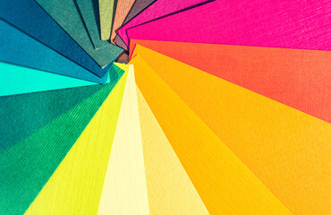 Obraz premium Color palette guide. Colored textured paper samples swatch catalog. Bright and juicy rainbow colors. Beautiful abstract background. Back to school. Office accessories.