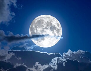 A bright full moon shines against a dark blue sky, surrounded by fluffy clouds