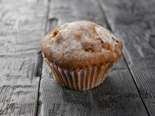 Rustic Muffin on Weathered Wooden Surface Capturing Homestyle Baked Goods Charm