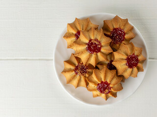 Delicious Star-Shaped Jam Cookies on White Wooden Table