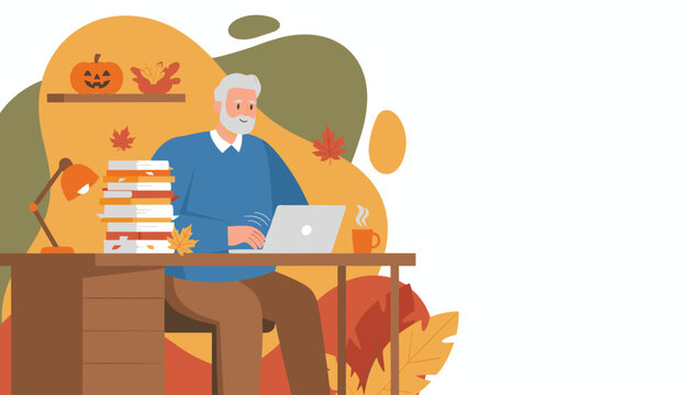 Smiling senior man uses a laptop at a desk surrounded by autumn leaves and festive fall decor