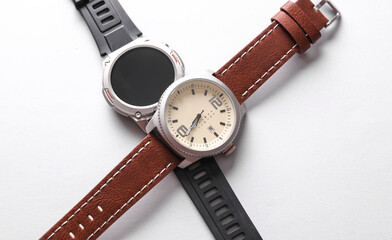 Analog and smart men's wristwatch on gray background