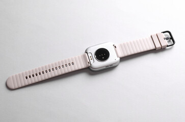 Modern smart bracelet on gray background