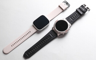 Two Modern smart bracelets on white background