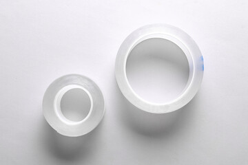 Rolls of transparent adhesive tape scotch on a gray background
