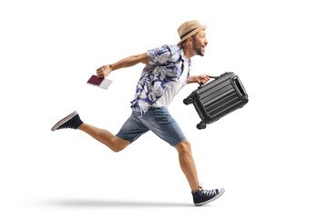 Male tourist running with a passport and a suitcase