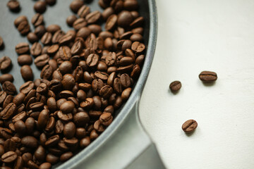 Coffee beans on a frying pan