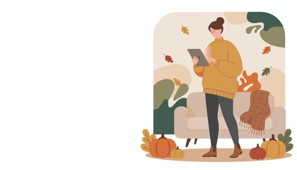 Woman in sweater using tablet in a cozy modern autumn home interior with pumpkins