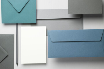 Floating envelopes and card on gray background with shadow. Minimalism, modern business still life, creative layout