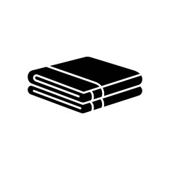 Folded towels stacked neatly on a white surface, ready for use in a bathroom or spa setting, conveying cleanliness and comfort.