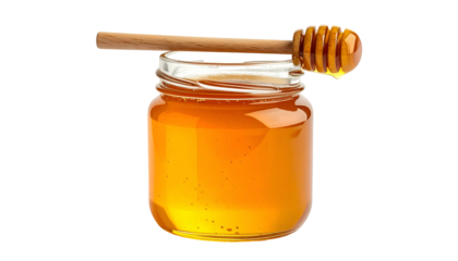 A clear glass jar filled with golden honey, a wooden dipper resting across the top