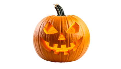 Carved, illuminated orange gourd with menacing face against a black backdrop
