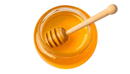 A glass jar filled with golden honey and a wooden honey dipper, overhead view, black background