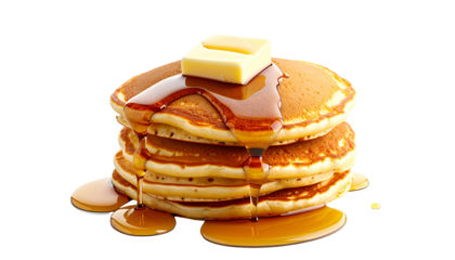 A stack of golden-brown breakfast cakes with melting butter and pouring syrup