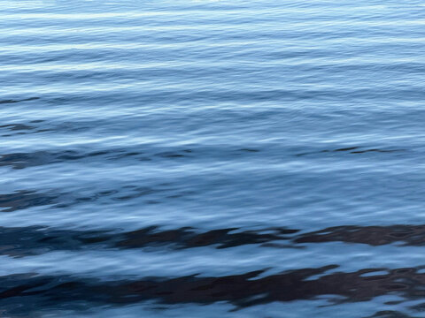 Rippled blue river water surface.