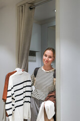 Black Friday. A woman in a store picking out clothes, the season of discounts and sales. A day of mega discounts, sale,Black Friday Shopping Week,Green Friday,cyber monday