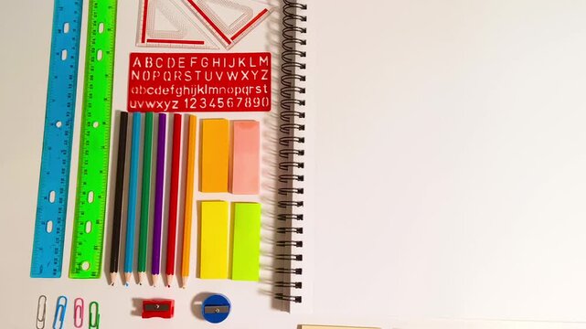Colorful school supplies and blank notebook beckon creative projects, perfect for education and design visuals, inspiring learning, crafting, and back to school promotions