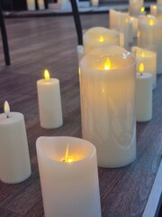 Burning candles on the stage where musical instruments are placed