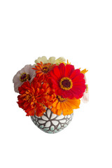 Photo of bouquet of colorful zinnia flowers in vase with transparent background