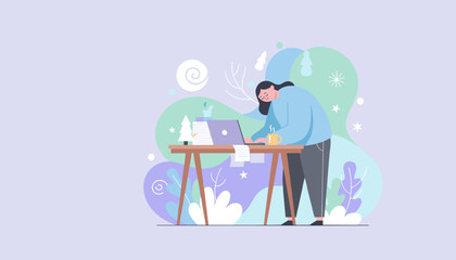 Woman suffering from burnout and seasonal fatigue working late at her desk in a winter setting