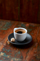 Cup of coffee on rustic wooden background. Soft focus. Copy space	